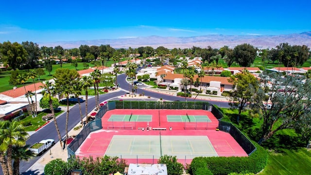 birds eye view of property with a mountain view