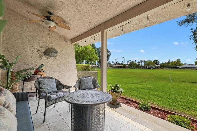 view of patio / terrace featuring ceiling fan