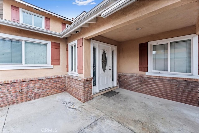 property entrance with a patio