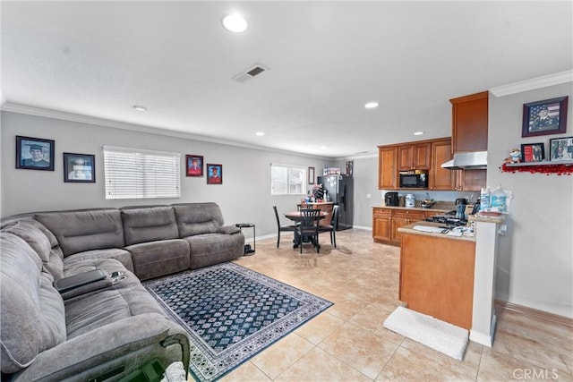 tiled living room featuring crown molding and plenty of natural light