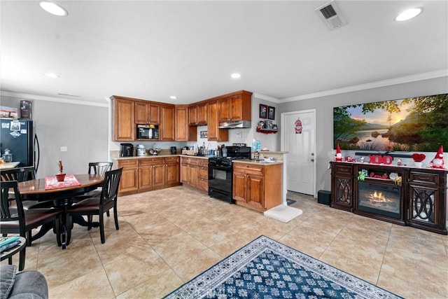 kitchen featuring ornamental molding, light tile patterned floors, and black appliances