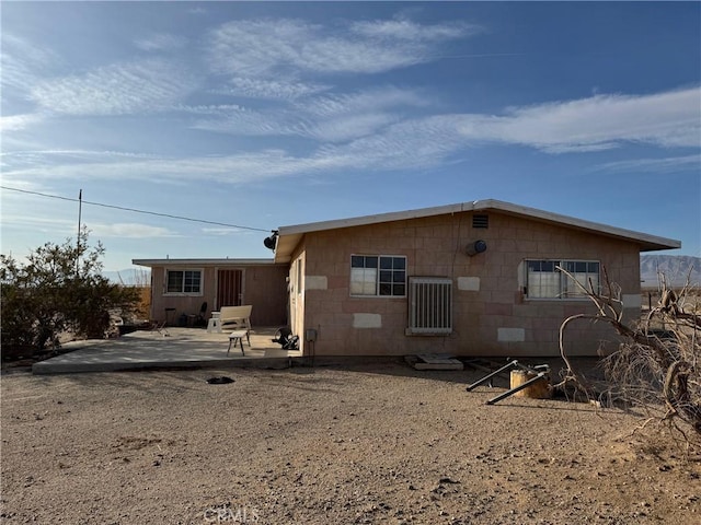 back of property featuring a patio area