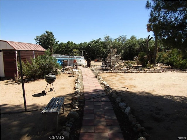 view of yard with a pool