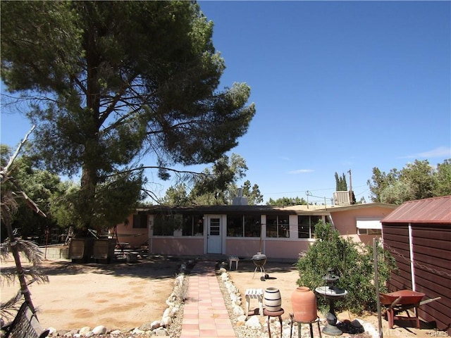 back of house featuring a patio