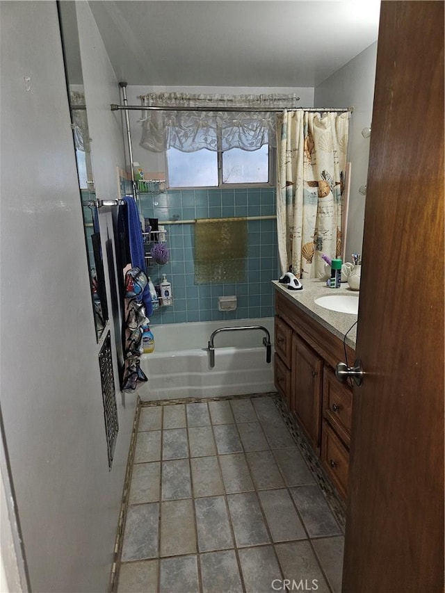 bathroom featuring vanity and shower / tub combo with curtain