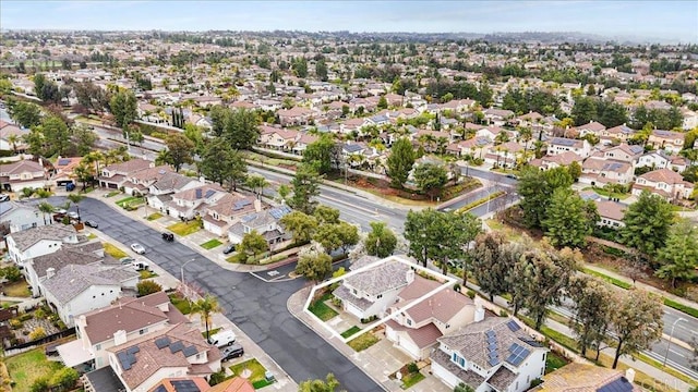 birds eye view of property with a residential view