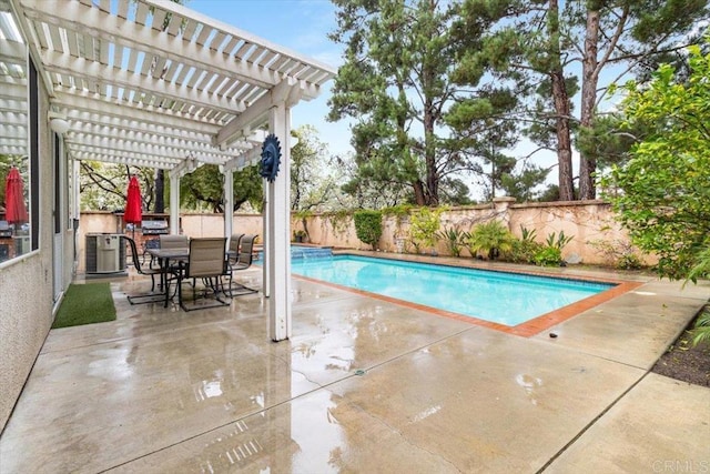 view of swimming pool with central air condition unit, a patio area, a fenced backyard, and a pergola