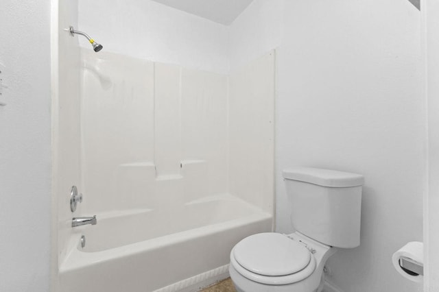 bathroom with shower / bathing tub combination and toilet