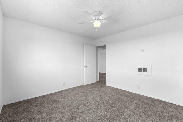 carpeted empty room featuring a textured ceiling and ceiling fan