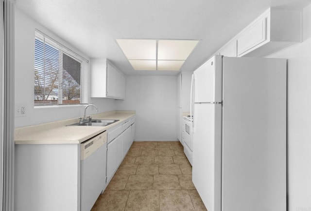 kitchen with sink, light tile patterned floors, white cabinets, and white appliances