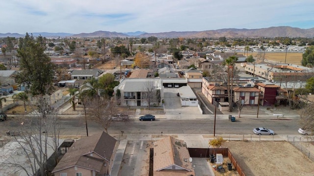 birds eye view of property featuring a mountain view