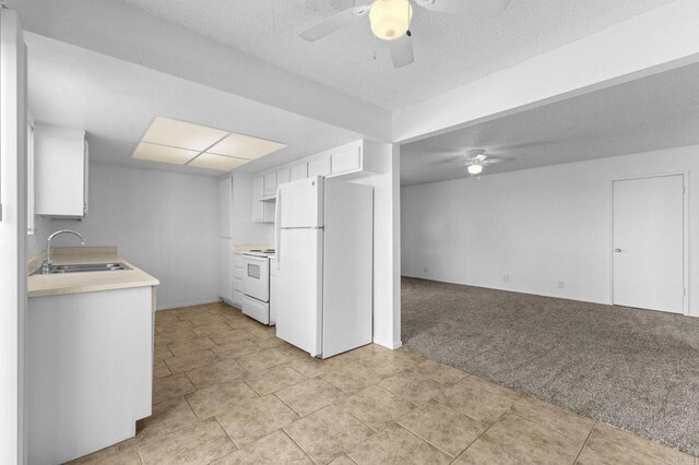 233 N Inez St, Hemet, CA 92543 - kitchen with white appliances, ceiling fan, light carpet, light countertops, and a textured ceiling