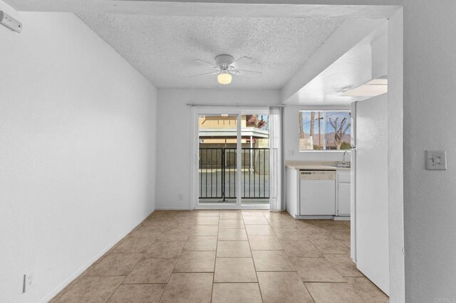 233 N Inez St, Hemet, CA 92543 - unfurnished room featuring healthy amount of natural light, a ceiling fan, a textured ceiling, and light tile patterned floors