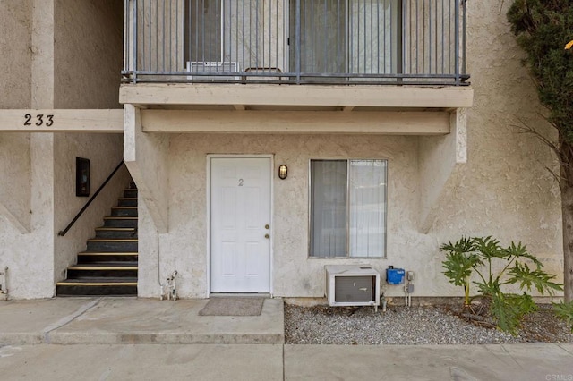 233 N Inez St, Hemet, CA 92543 - view of exterior entry featuring a balcony and stucco siding