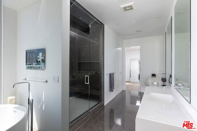 bathroom featuring vanity, radiator, and a shower with shower door