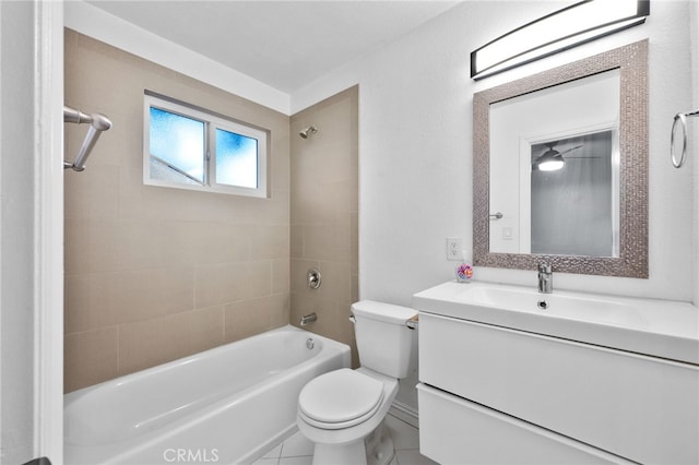 full bathroom with vanity, tiled shower / bath combo, and toilet