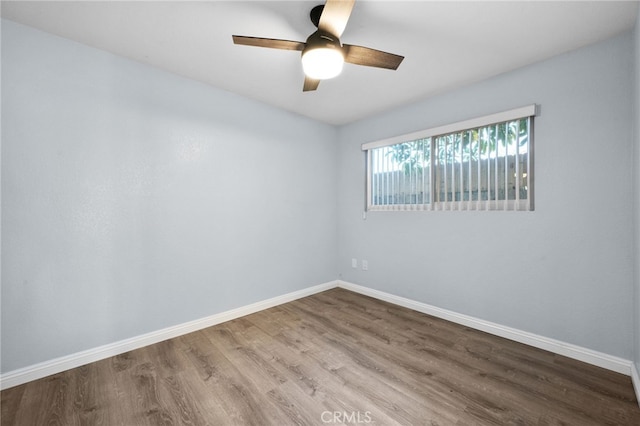 empty room featuring hardwood / wood-style floors and ceiling fan