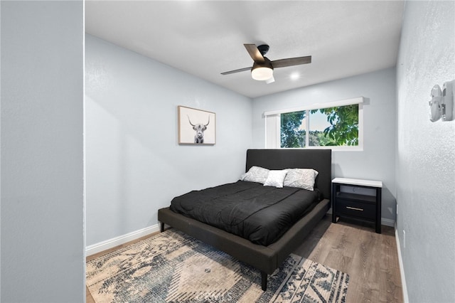 bedroom featuring ceiling fan and wood-type flooring