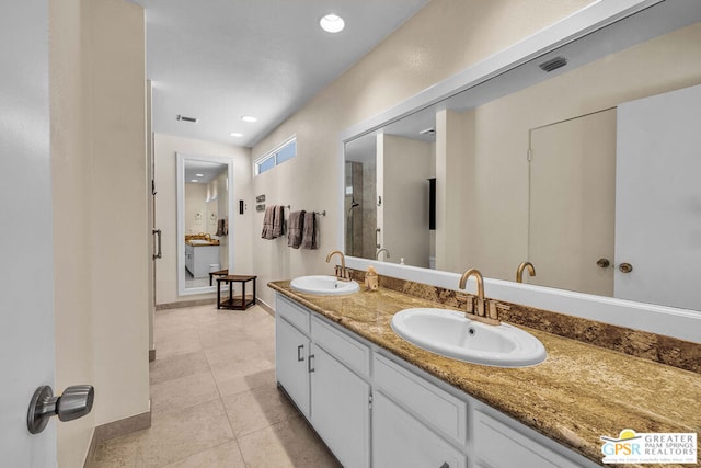 bathroom with vanity and tile patterned flooring