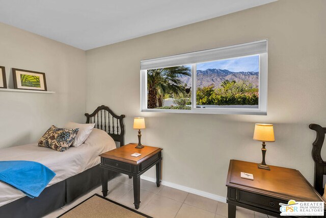 bedroom featuring light tile patterned floors