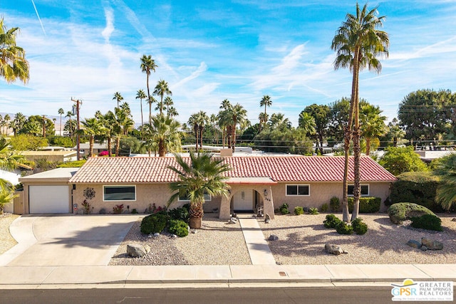 ranch-style house featuring a garage