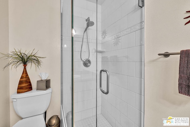 bathroom featuring walk in shower and toilet