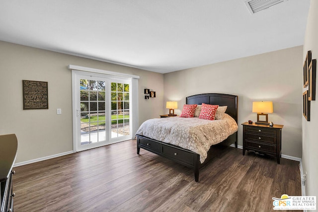 bedroom featuring access to exterior and dark hardwood / wood-style floors