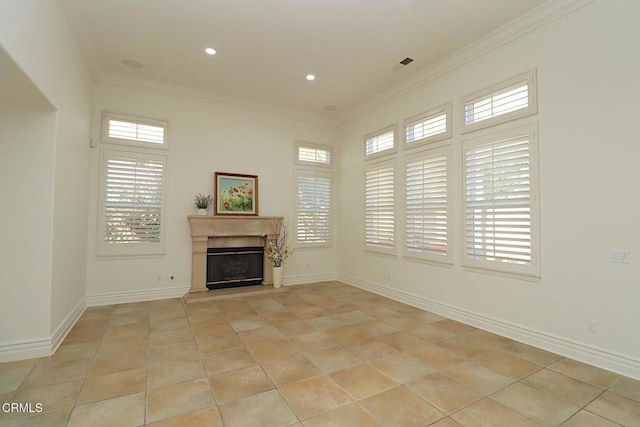 unfurnished living room with ornamental molding and light tile patterned flooring