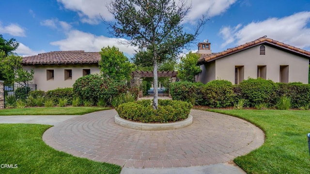 view of property's community with a pergola and a lawn