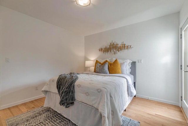 bedroom with hardwood / wood-style floors