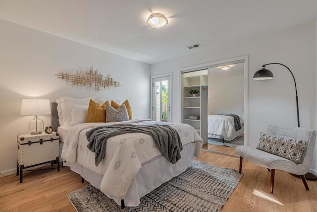 bedroom featuring a closet and light hardwood / wood-style flooring