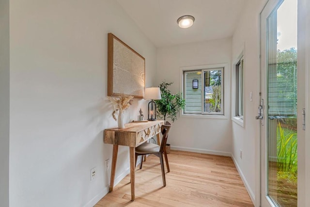 doorway to outside with light wood-type flooring