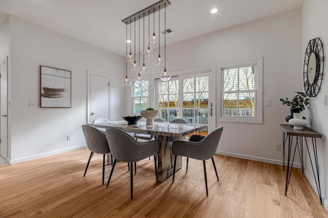 dining room with light wood-type flooring