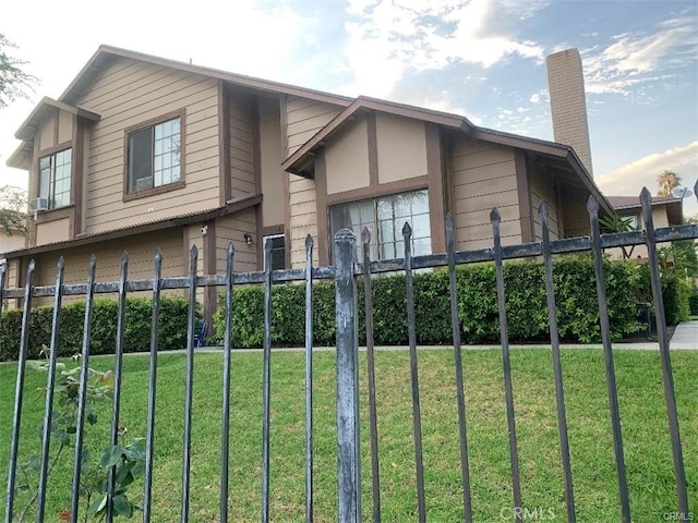 view of property exterior with a yard