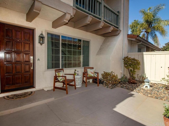 doorway to property featuring a patio area