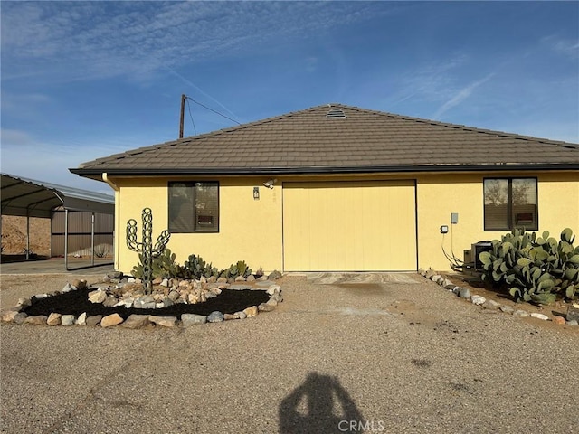 view of side of property with a carport