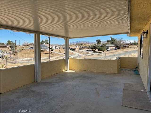 view of patio featuring a balcony