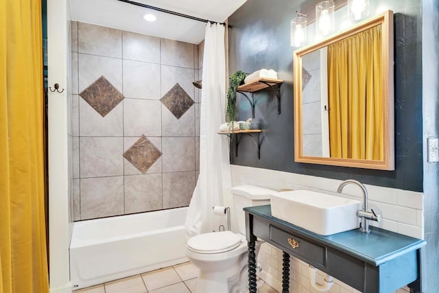 full bathroom with shower / tub combo, sink, tile patterned flooring, and toilet