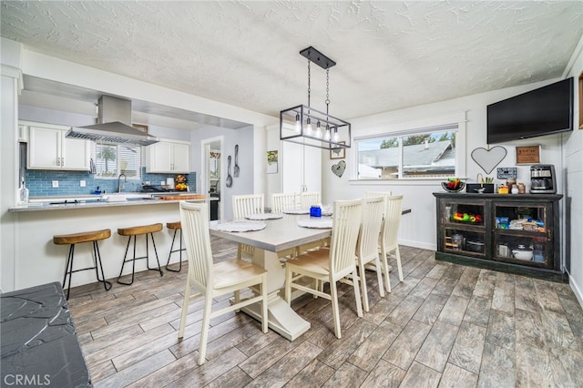 dining area with a textured ceiling