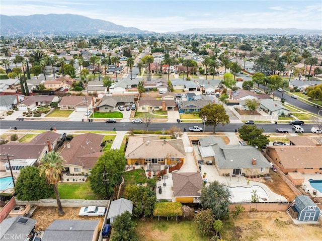 birds eye view of property featuring a mountain view