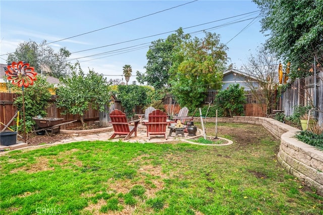 view of yard featuring a patio area and an outdoor fire pit