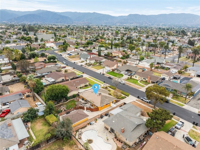 birds eye view of property featuring a mountain view