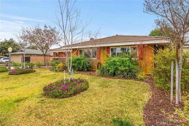 ranch-style house with a front lawn