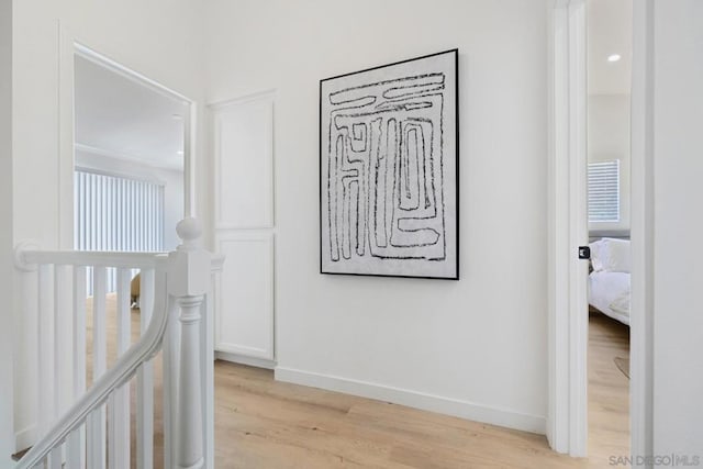 hall with light hardwood / wood-style flooring