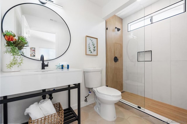 bathroom with walk in shower, sink, a wealth of natural light, and toilet