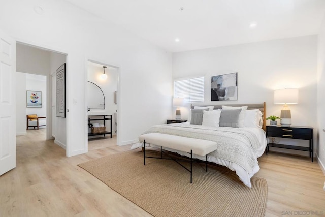 bedroom with light hardwood / wood-style floors