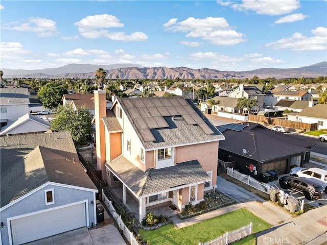 birds eye view of property featuring a mountain view