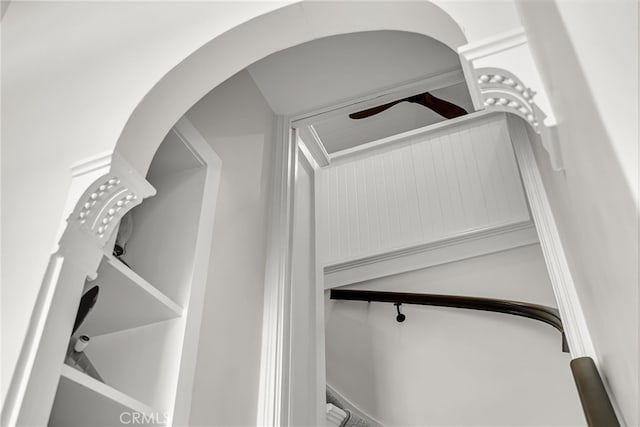 stairway with ceiling fan