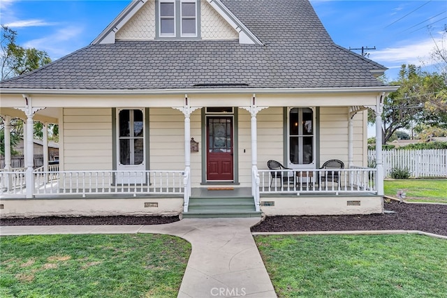 view of front of house with a porch and a front lawn