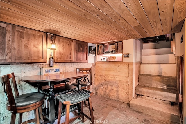 dining area with wood ceiling